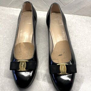 Classic Ferragamo black patent bow shows